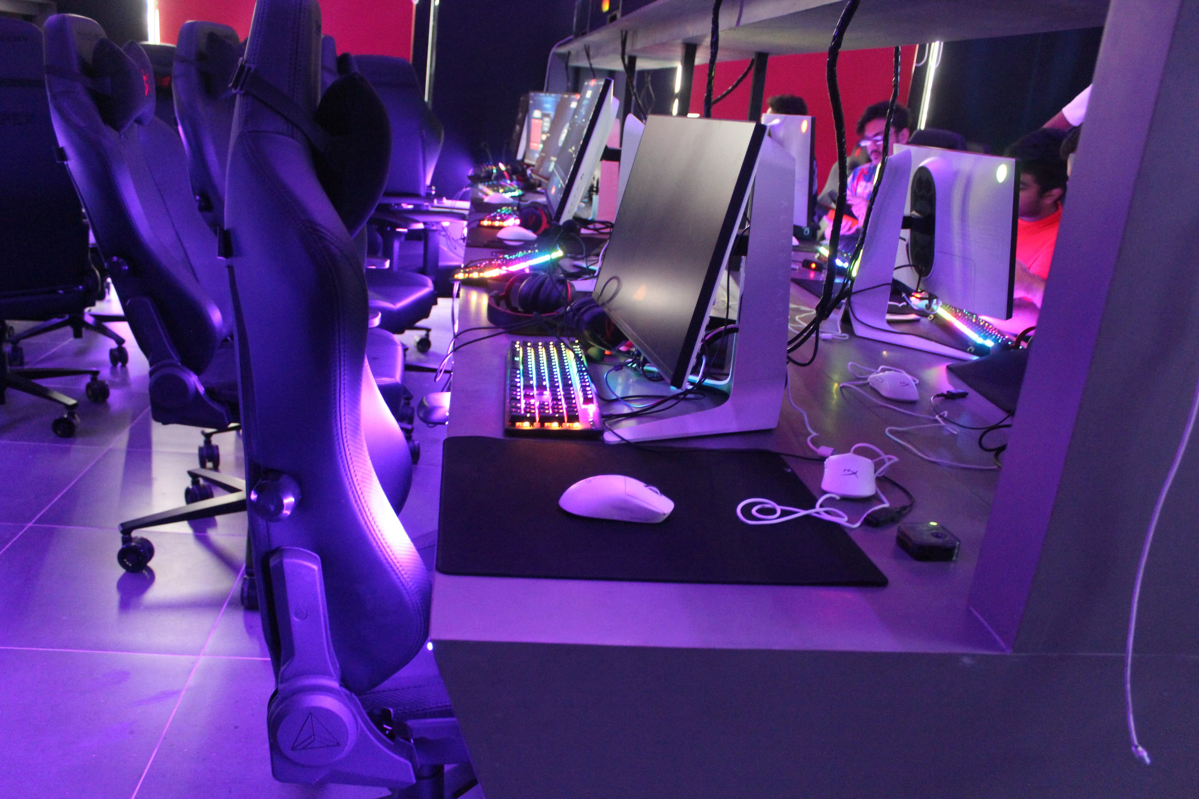 Purple-lit E-Blue gaming pods at Gamers Guild Banjara Hills