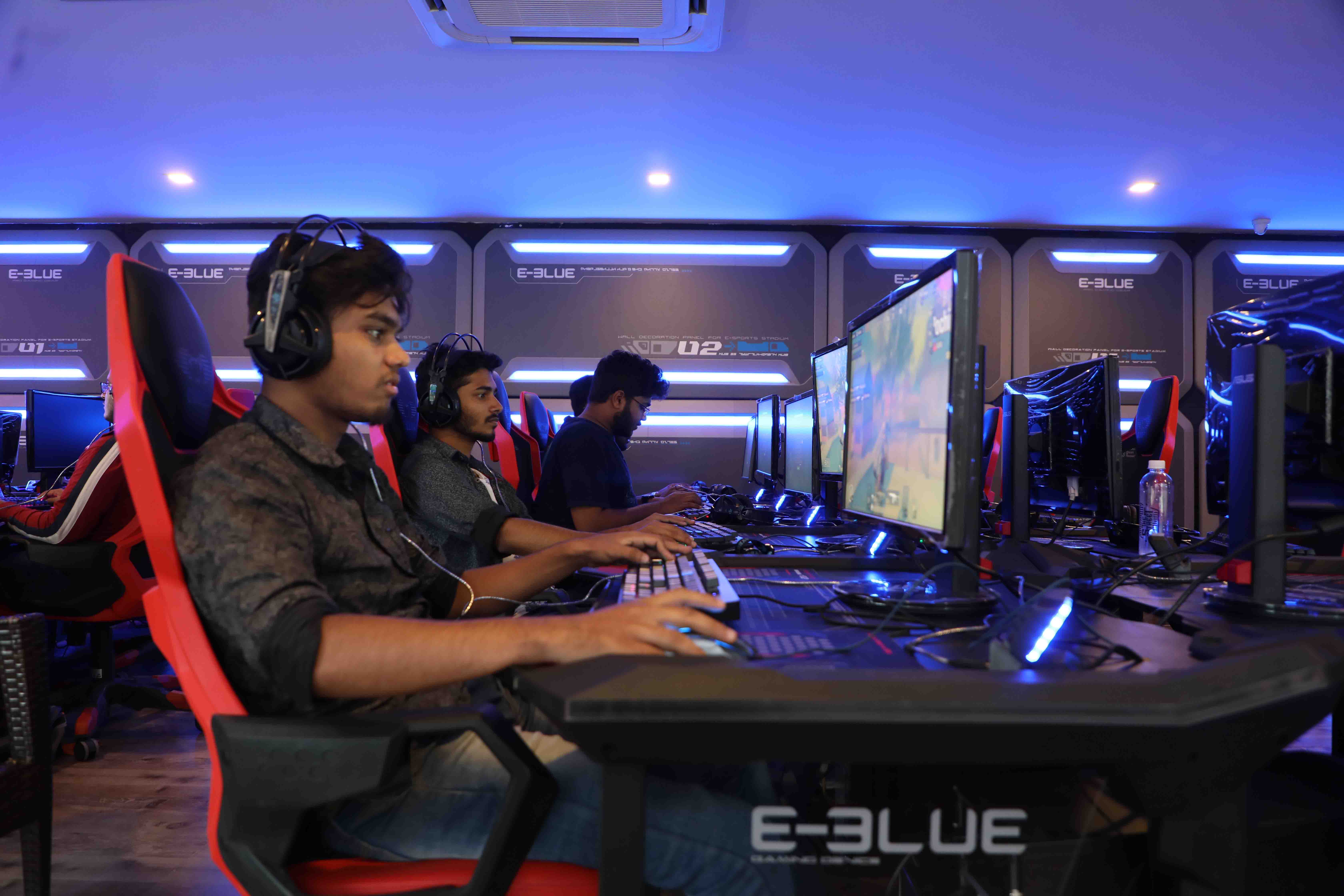 Players mid-match on the competitive floor at a Gamers Guild branch
